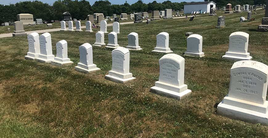 Clean gravestones at cemetery