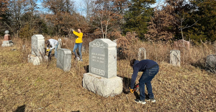 Cleaning headstones with Wet & Forget is simple, especially if you bring helpers.